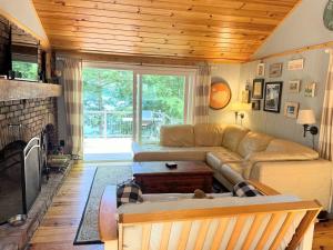 a living room with a couch and a fireplace at HOLIDAY COVE - LIMIT 8 villa in Naples