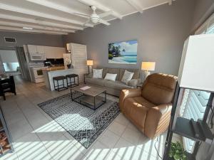 a living room with a couch and a table at Sea Crest in Sarasota