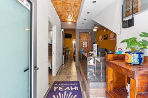 a restaurant with a counter in the middle of a room at Bungalows Yeah Los Ayala in Los Ayala