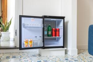 an open refrigerator with drinks inside of it at Villa Anna in Meta