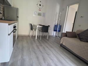 a living room with a couch and a table at Nido Ticino in Bernate Ticino