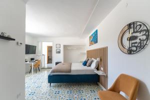 a hotel room with a bed and a desk at Villa Anna in Meta