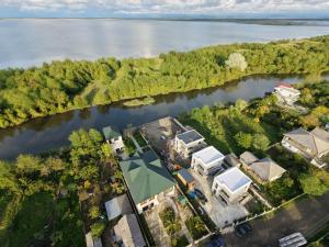 an aerial view of a house next to a lake at Riverside Cotagge in Poti