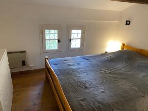 a bedroom with a large bed in a room at Azurea in Saint-Cyr-sur-Mer