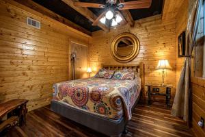 a bedroom with a bed in a wooden cabin at Riverview Cabin in Helen