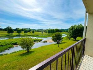 a balcony with a view of a river at Landmark Inn On The River Sevierville in Sevierville
