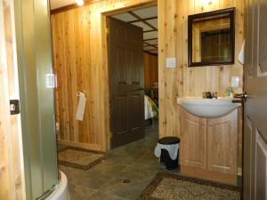 a bathroom with a sink and a toilet at Domaine Valga in Saint-Gabriel +71 photos