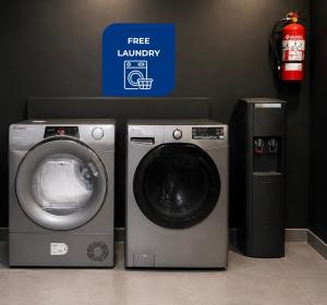 a washing machine and a dryer in a room at Live Soho Boutique Hotel & Apartments in Buenos Aires +8 photos