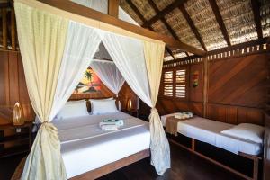 a bedroom with two beds in a room at Pousada Casa Suiça in Itarema +147 photos