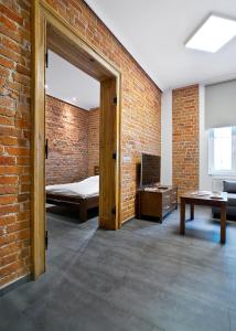 Posteľ alebo postele v izbe v ubytovaní Apartamenty Młyńska 4 + 37 fotografií