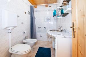 a small bathroom with a toilet and a sink at Casa Bruna Valmalenco, Casa vacanze sopra Caspoggio in Caspoggio +24 photos