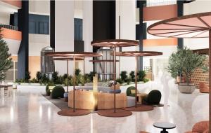 a lobby with tables and chairs and umbrellas at The Arlin, Arlington, a Tribute Portfolio Hotel in Arlington
