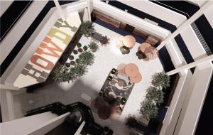 an overhead view of a restaurant with tables and umbrellas at The Arlin, Arlington, a Tribute Portfolio Hotel in Arlington