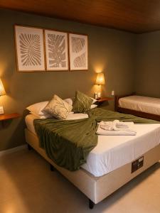 a bedroom with a large bed with towels on it at Casas de Juan in Morro de São Paulo +81 photos