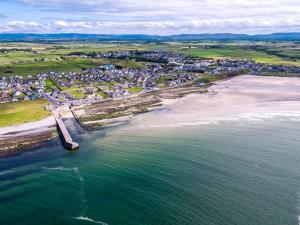 an aerial view of a beach and the ocean at Wild Atlantic View in Walshestown