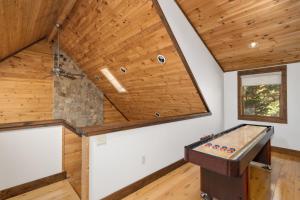 a pool table in a room with a wooden ceiling at 1 Kingfisher in Blowing Rock