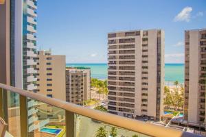 a view of the ocean from the balcony of a building at Freitas Residence - Quinta Manuel Rodrigues in Recife