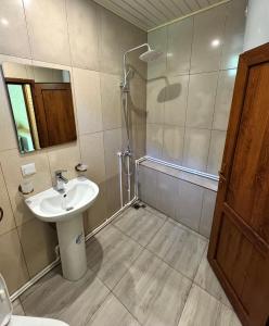 a bathroom with a sink and a shower at Riviera Guesthouse in Dilijan +46 photos
