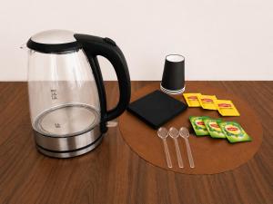 a counter with a coffee pot and utensils on a table at Chambre dans villa privée, charme et confort proche Vélodrome & plages - Parking privé in Marseille +12 photos