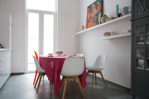 a kitchen with a table and chairs in it at B&B Villa 36 in Brussels