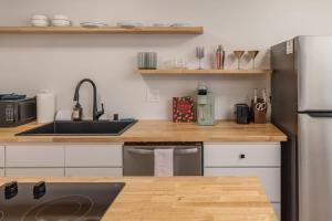 a kitchen with a sink and a counter top at Modern Studio Downtown Anchorage in Anchorage