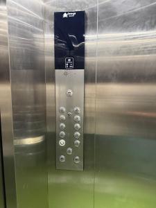 a elevator door with a button with a number on it at Open Hotel by Olive - G SILVER SS hotel in Tiruppūr