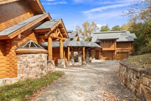 a log home with a pathway leading up to a house at Hamatreya- Panoramic Shenandoah Views in Rileyville