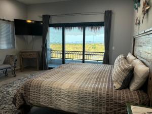 a bedroom with a bed and a large window at Sunny Poolside Escape Near the Beach in Los Barriles +35 photos