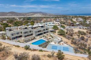 an aerial view of a house with a swimming pool at Modern 4BR Villa with Rooftop & Pickleball in Los Barriles