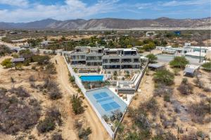 an aerial view of a house with a swimming pool at Modern 4BR Villa with Rooftop & Pickleball in Los Barriles
