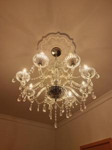 a large chandelier hanging from a ceiling at Hotel Casa Dharma in Popayan