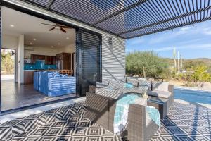 a patio with a couch and a table on a deck at Pool with a View in Buena Vista in Buenavista