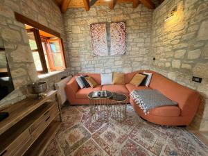 a living room with a couch and a table at Villa Ionis in Volímai