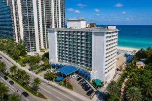 an aerial view of a hotel with the beach and buildings at Ocean View Apartment In Sunny Isles in Sunny Isles Beach