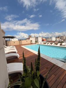 a view of a swimming pool on top of a building at Hotel Alvarado Suites in Salta