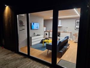a living room with a view of a living room at B-House in Tyudov