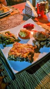 a plate of food sitting on a table at Sahara Sky Luxury Camp in Merzouga +28 photos