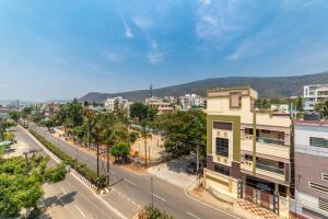 an aerial view of a city with a street at Lumina Stays-Modern Luxury Rooms, Near NAD in Visakhapatnam