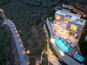 an aerial view of a house with a swimming pool at Paleokastro Villas with Private Heated Pool, Top Views - Next To Center - Top WiFi in Kissamos