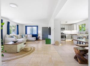 a living room with a couch and a table at Slice of Paradise with Private Beach in Agat