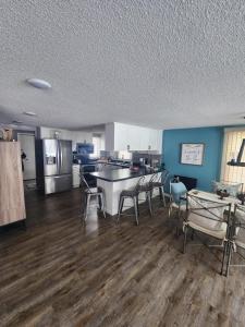 a kitchen with a table and chairs in a room at NEW Sunset Cottage - Lake Lida in Pelican Rapids