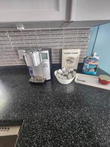 a counter top with a coffee maker and a box on it at NEW Sunset Cottage - Lake Lida in Pelican Rapids