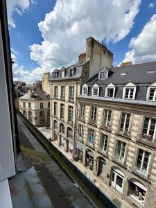 a view from a window of a city with buildings at Le B - Appartement centre ville en duplex in Rennes