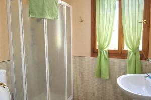 a bathroom with a shower and a sink at B&B Il Fiocinino in Comacchio