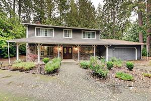 a house with a garage in front of it at Woodinville Escape in Woodinville
