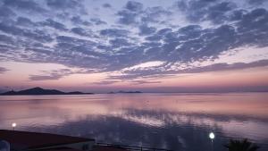 a sunset over a large body of water at Casa Gaia in La Manga del Mar Menor +3 photos