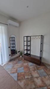 a room with a mirror and a tiled floor at DIMORA REALE - Charming House Caserta in Casagiove +24 photos