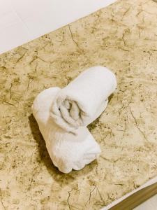 a roll of dough sitting on top of a table at Nigmt Siwa Hotel in Siwa +44 photos