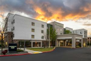 a white building with a sign in front of it at TownePlace Suites by Marriott Reno in Reno