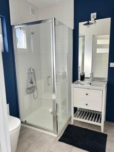 a bathroom with a shower and a toilet and a sink at Poprzeczna 7 in Sarbinowo +73 photos